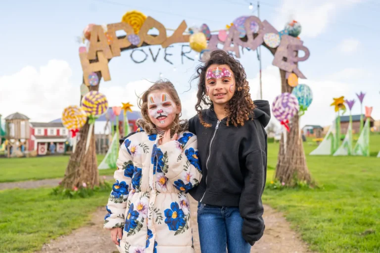2 girls in front of the easter archway